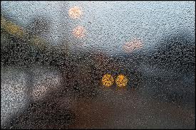 freezing drizzle on a bus shelter window