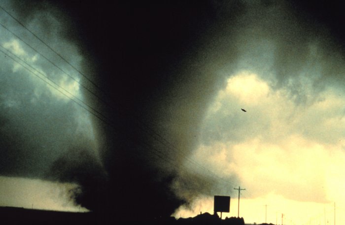 a tornado forms within a severe thunderstorm (NOAA)